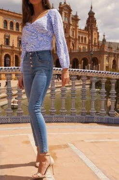 Light Wash Button Front Skinny Jeans -MIDI Clothing Shop 402de15a71da84411192fabadb5019c9c5e98979